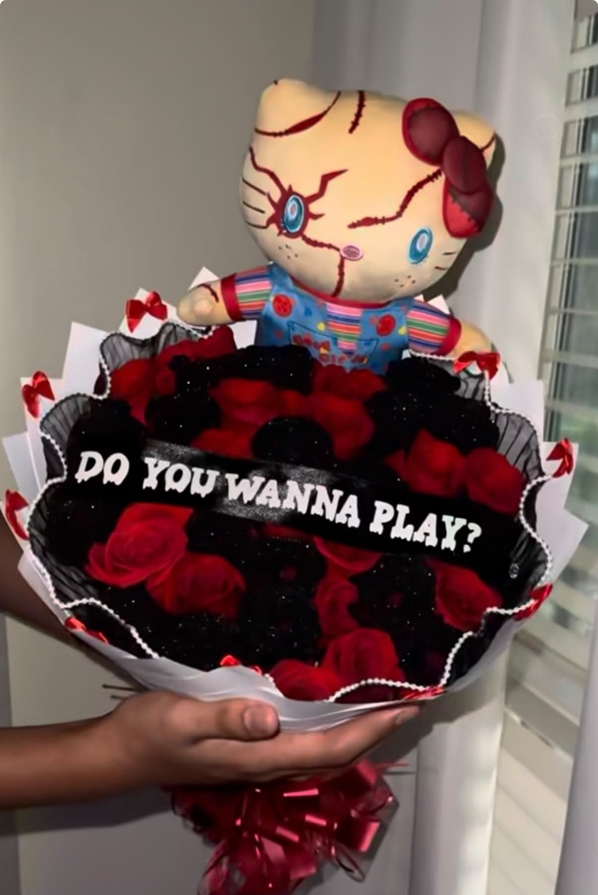 Halloween bouquet of black and red roses with a Chucky Hello Kitty plush